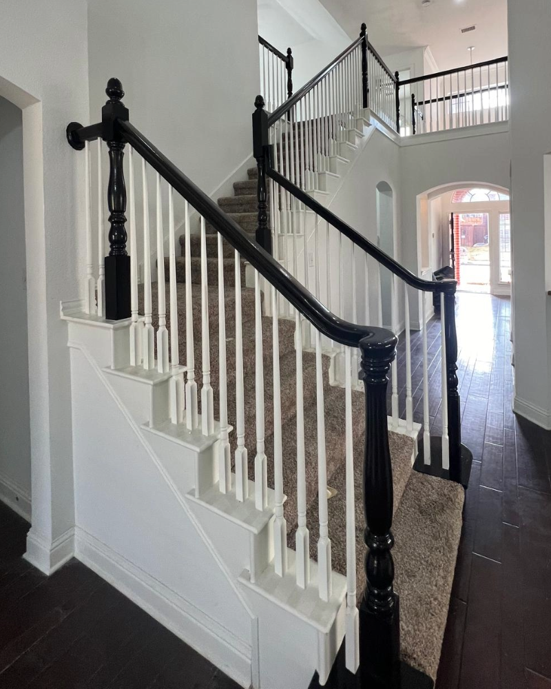 staircase painted white with black railing