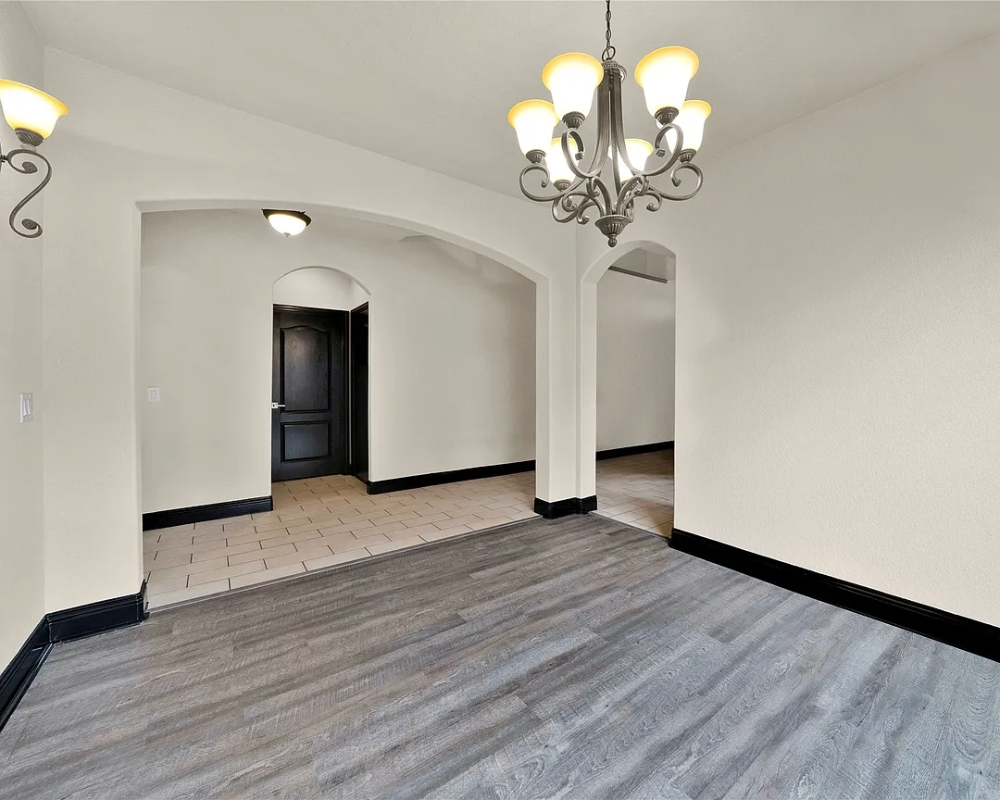 living room and hallway painted white walls with dark trim